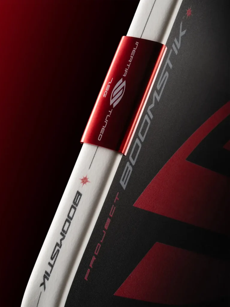 Close-up of the Selkirk Boomstik paddle MOI Tuning System showing precision weights along the edge guard for balanced control.