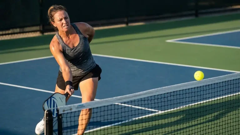 A pickleball player practices with their non-dominant left hand, focusing on balance, control, and form as part of a seven-day lefty reset training challenge.